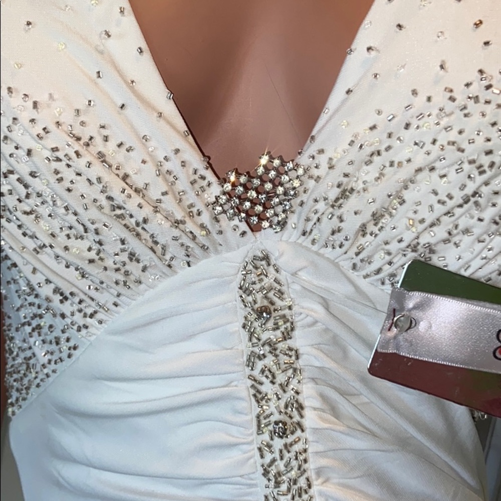 Beautifly size 6 New With Tags white halter gown with beads 100% polyester